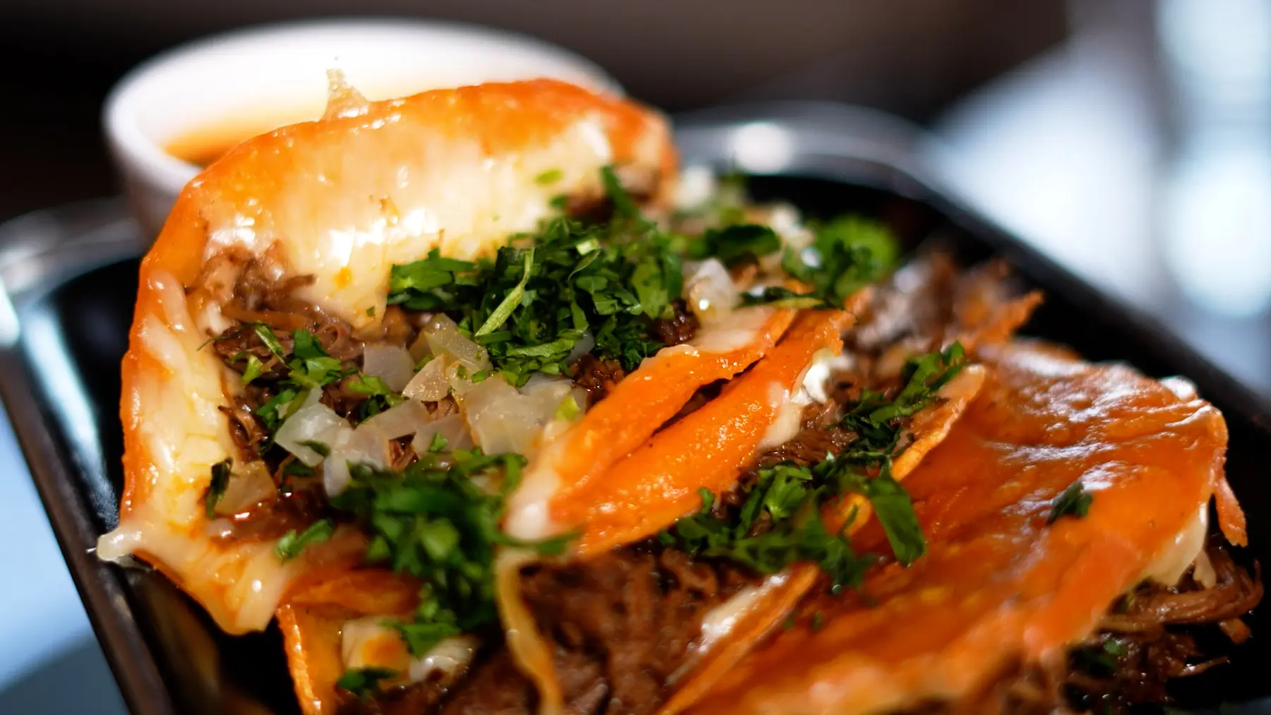 Close-up of a cheesy quesabirria taco